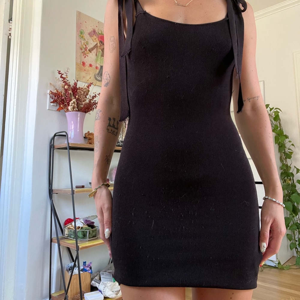 Black ribbed knit mini bodycon dress with ties on the shoulders #dresses